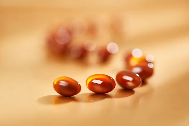 Coenzyme Q10 (CoQ10) softgel capsules representing a dietary supplement studied for metabolic health and energy metabolism.