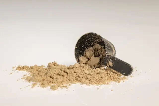 Standardized collagen peptide powder and supplements next to a healthy drink, comparing food-based collagen with peptide supplementation.